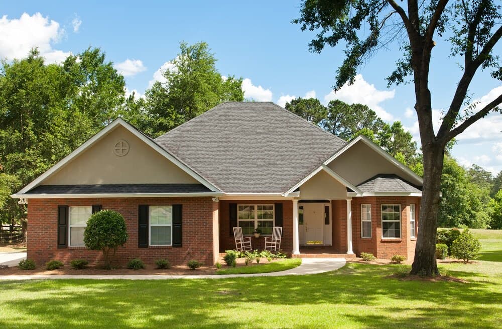 house with tree in front yard