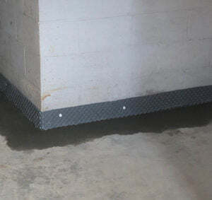 newly poured basement floor with water drainage installed