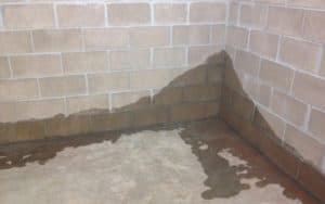 water seeping into basement corner