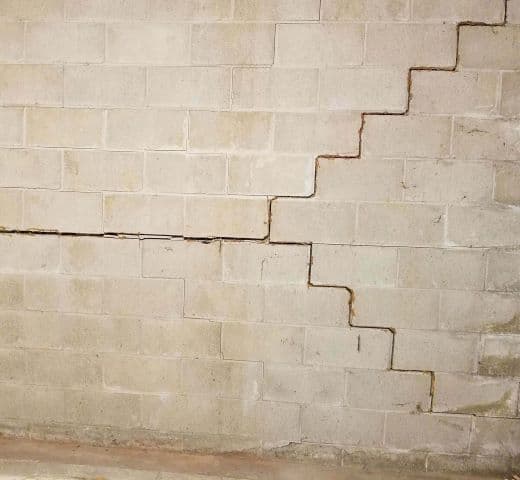 concrete block wall, with multiple cracks