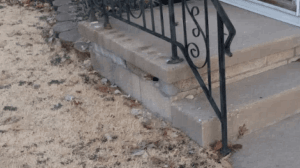 decaying porch foundation