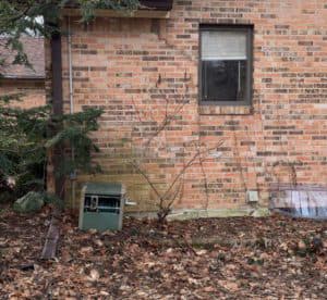 home with cracks in the brick exterior