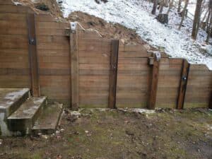 retaining wall repaired by helical tiebacks